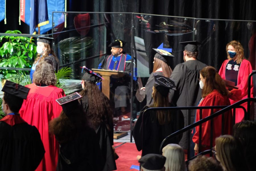 Members of the Class of 2020 line up to accept their respective degrees from President Rochon Saturday. Two of the four commencement ceremonies Saturday were for members of the Class of 2020 who did not get to walk in 2020 because of COVID-19 pandemic restrictions.