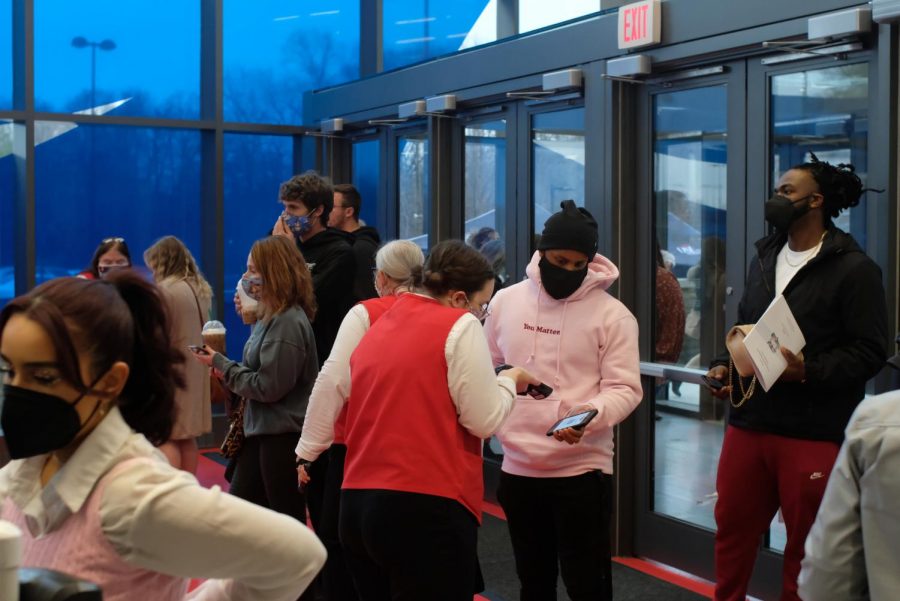 Guests check into the event at the entrance of the Screaming Eagles Arena Saturday.
