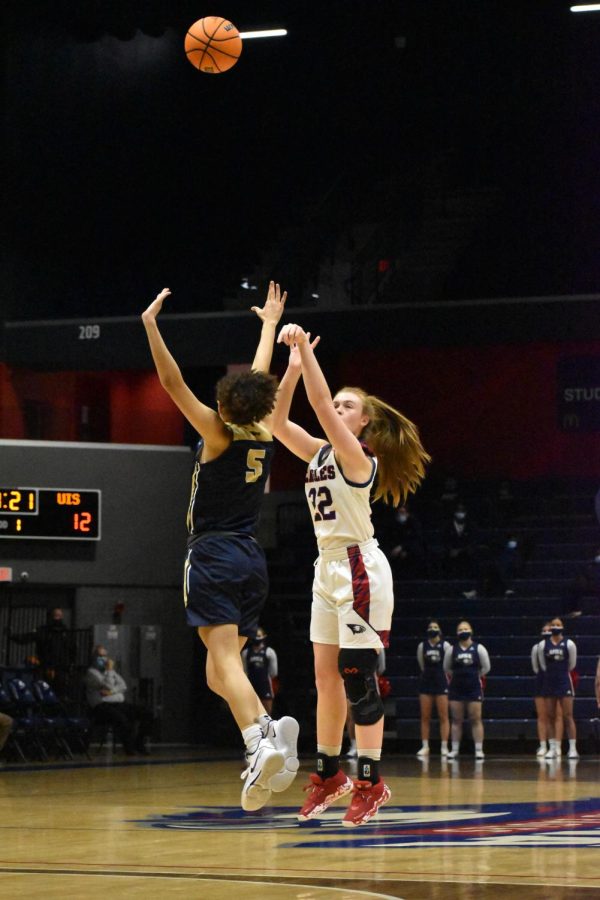 Sophomore forward Meredith Raley goes for a three-point shot. Raley had 18 points for the Eagles.
