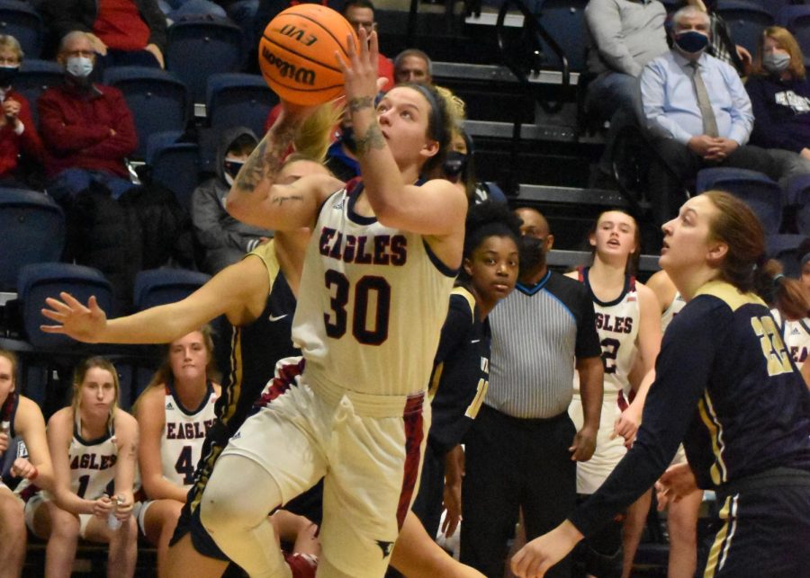 Emma DeHart, fifth-year senior, goes up for a layup. DeHart led the Eagles with 19 points.