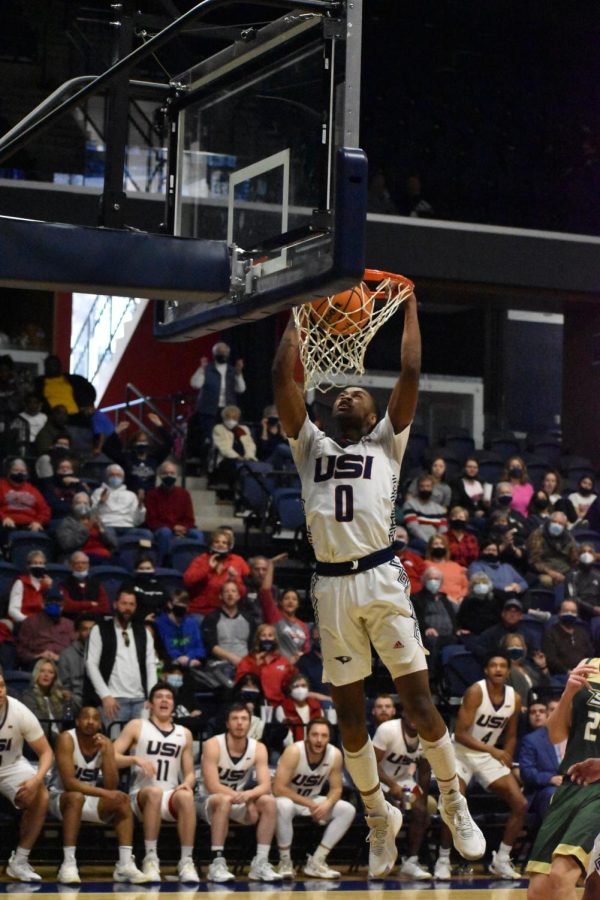 Jelani Simmons, a junior guard, dunks the ball Saturday afternoon. Simmons had 15 points for the Eagles.