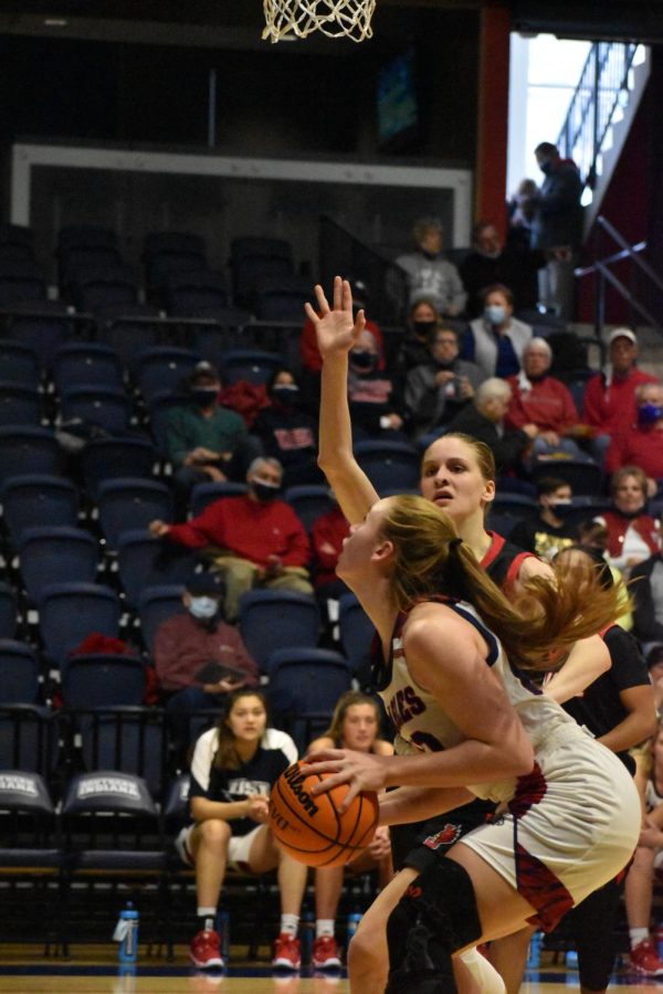 Meredith Raley, sophomore forward, looks for a shot underneath the basket. Raley scored 15 points for the Eagles.
