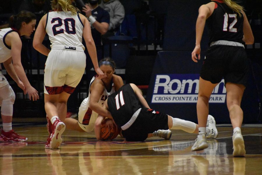 Hannah Haithcock, junior forward, fights for possession of the ball against a William Jewell College player.