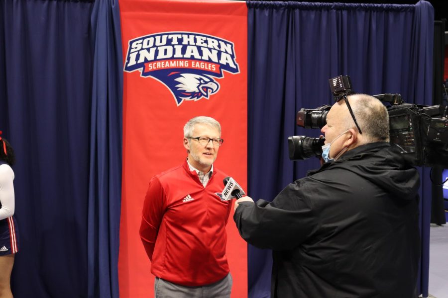 Jon Mark Hall speaks to a reporter after USI announced joining the Ohio Valley Conference.