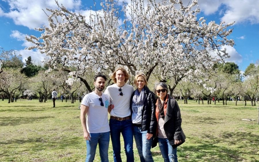 Chase poses in front of an almond tree at Quinta de los Molinos with friends and family. 
