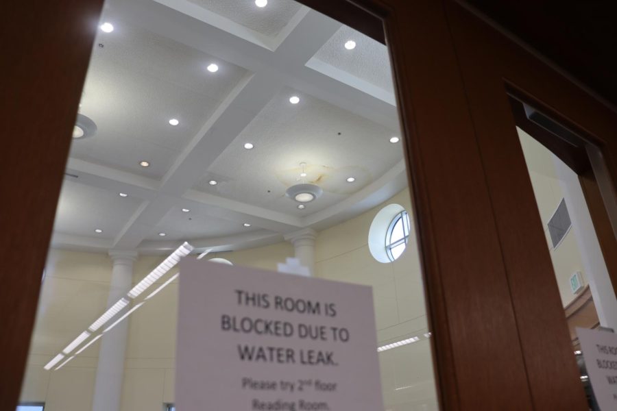 A sign sits on the doors outside of the fourth floor reading room. After an evaluation on Tuesday, faculty and contractors have deemed the room safe for people to be in.