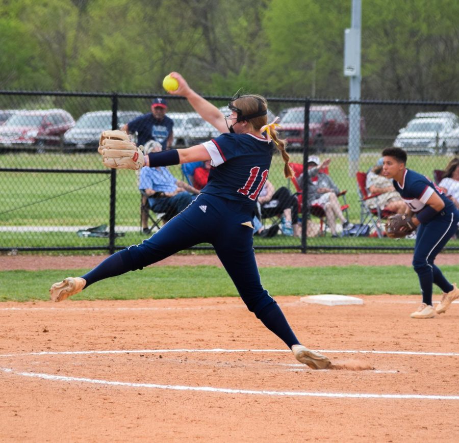 Josie Newman, freshman pitcher and infielder, winds up for a pitch at the game Sunday. Newman had a spectacular season with the Eagles and held a 1.99 ERA in over 100 innings pitched.