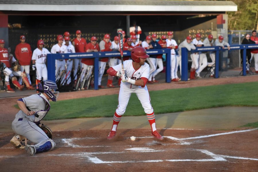 Tyler Wheeler, sophomore infielder and pitcher, narrowly avoids the ball while batting Thursday evening.