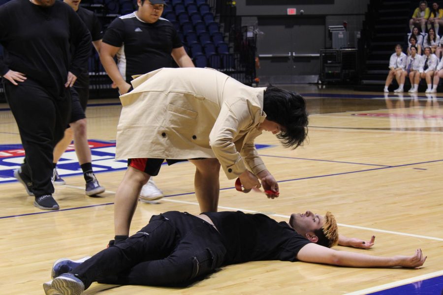 The members of Lambda Chi Alpha based their performance on the TV show Criminal Minds. Mark Song, junior exercise science major, put a piece of red tape on Christian Ruth, freshman art major, to mark him as dead in their performance.