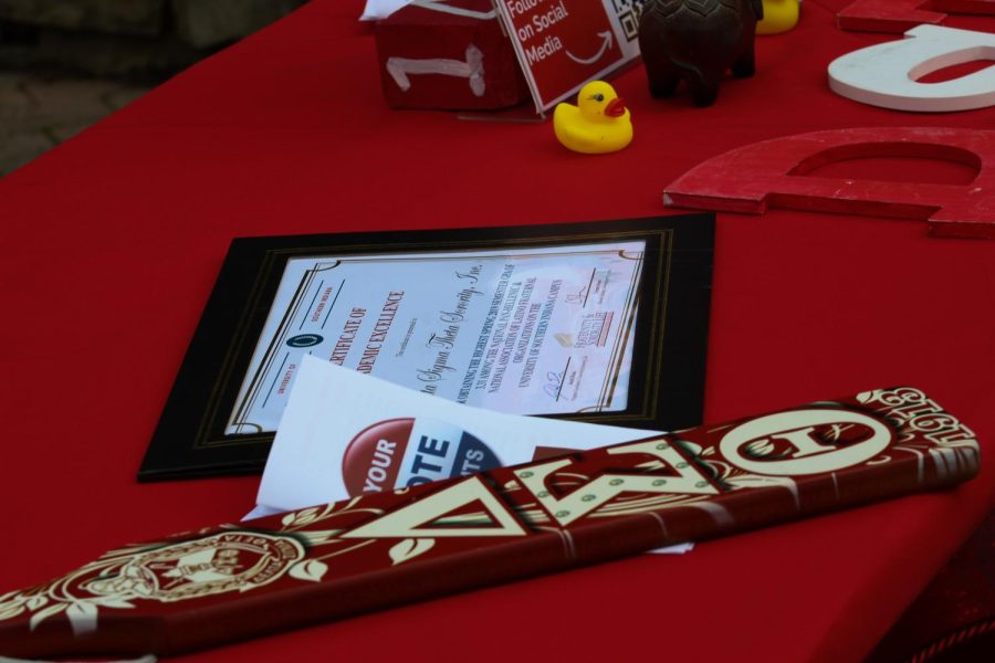 Delta Sigma Theta displayed their sorority certificate of academic excellence next to the letters of their sorority at the Divastating event during Spring Fest 2022. Divastating included painting, dancing and cornhole on Rice Plaza.