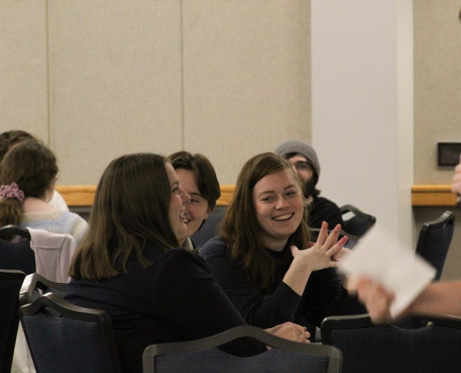 (Left to right) Anna Ardelean, Student Government Association president, Josi Barscz, SGA chief of staff, and Erika Uebelhor, SGA attorney general, laugh at the Nerdology hosts on Thursday.