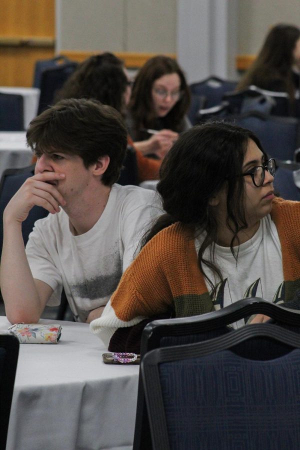 (Left to right) Peyton Frymire, Freshman (undecided), and Catalina Baker, Sophomore sociology major, discuss a question/questions at the SpringFest 2022 Nerdology event.
