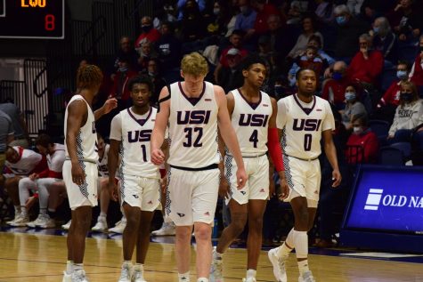 USI mens basketball take the floor after a timeout against the University of Illinois-Springfield. 