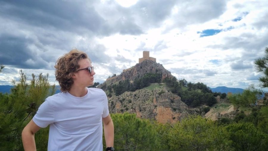 Chase Hollenkamp, sophomore economics and global studies major, stands in front of the Castle of Segura de la Sierra.