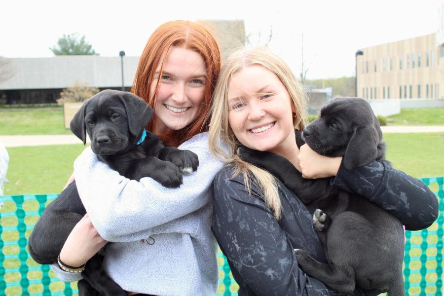 Jessica Laine, freshman biology major, and Julia Hagan, freshman exercise science major, smile with their matching puppies. The Pet-A-Pup event is a good way for students to relieve their stress while also raising money for a good cause. All proceeds from this event went towards the humane society. The Pet-A-Pup event was held on Wednesday from 9 to 3 on the Quad.
