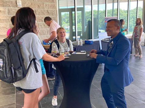 Sudesh Mujumbar, Romain College of Business dean, greets Camille Quinn, freshman management major, Cassy Griffin, freshman business major, and Sydney Manzini, freshman business administration major, at the "Meet the Dean" event in the Business Education Center Aug. 26. The event was held for students and faculty to meet Mujumbar.