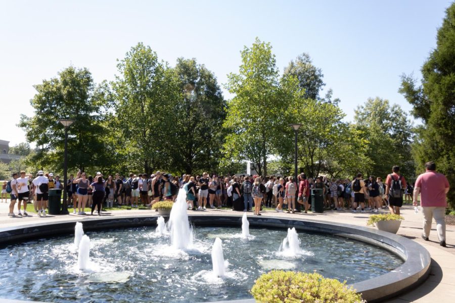 Students wait on The Quad for Sister Cindy to arrive to campus Wednesday. 