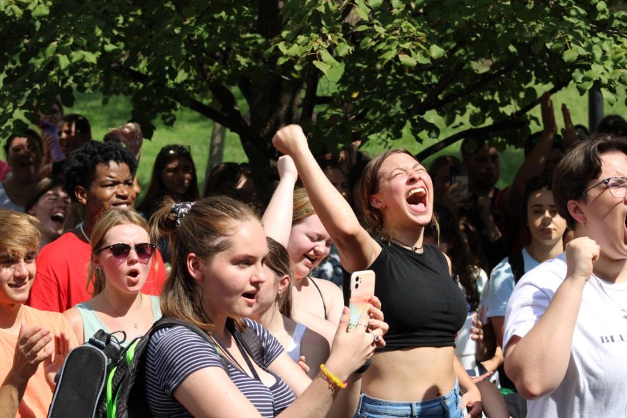 Students roar and cheer as Sister Cindy shouts her religious beliefs on campus Wednesday.