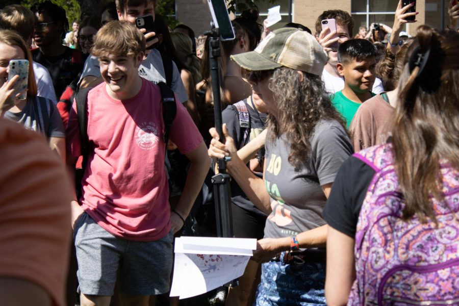 Students follow Sister Cindy as she walks across The Quad to the free speech zone Wednesday. 

