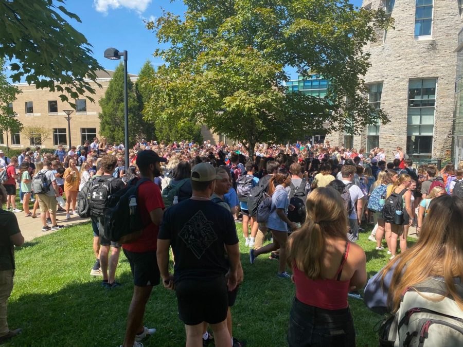 A large crowd gathers outside University Center East after Sister Cindy enters the building Wednesday.