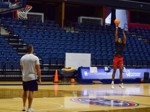 Kiyron Powell, freshman center, warms up before the first day of practice on Sept. 27. The mens basketball team is scheduled to begin their DI career Nov. 7 at University of Missouri.