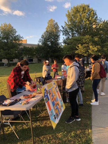 Students gather at the tables set up for the Latinx Heritage Festival on The Quad Wednesday. The tables were set up by SGA, the Panamanian Association and the Multicultural Center, who all hosted the festival. (Photo by Alyssa DeWig)