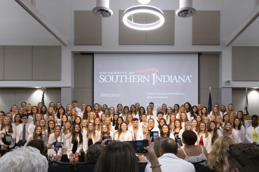 Nursing students pose for a picture at the end of the White Coat Ceremony in Carter Hall Sept. 11.