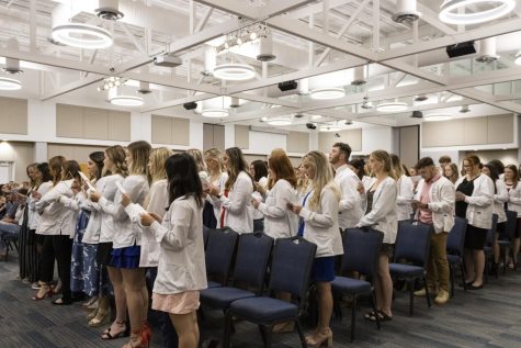 Nursing students recite the White Coat Ceremony Oath in Carter Hall Sept. 11. With this oath, the students pledged to accept the duties of the nursing profession and provide high quality care.