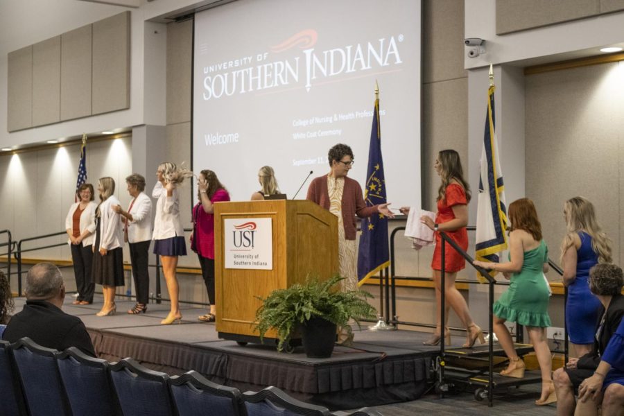 Nursing students receive their white coats from nursing faculty in Carter Hall Sept. 11. This ceremony signified the students entry into the medical field.