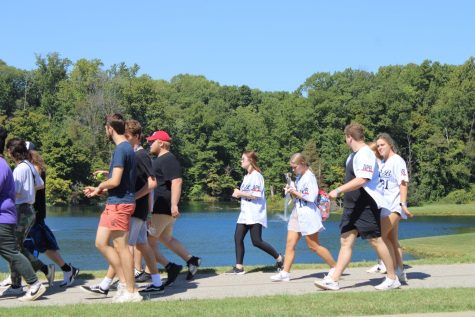 Students walk in Active Minds annual National Suicide Prevention Month Memory Walk Saturday in front of Reflection Lake. (Photo by Bryce West)