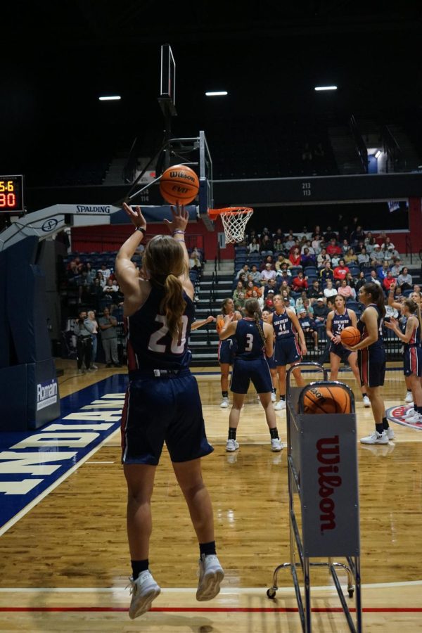 Vanessa Shafford, sophomore guard, shoots during the final round of the 3-point contest against the mens basketball team at the 2022 Midnight Madness event Thursday in the Screaming Eagles Arena.