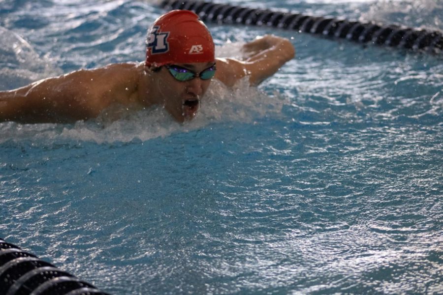 Chris Brown, freshman biology major, competes in the swimming competition against Valparaiso in the Aquatic Center Saturday.