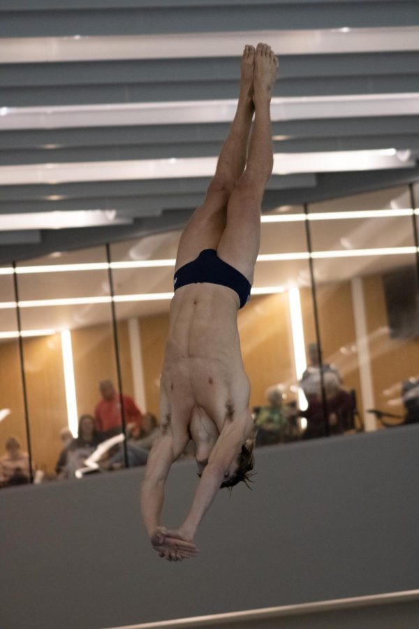 Lane Pollack, freshman finance major, competes in a diving competition against Valparaiso in the Aquatic Center Saturday.