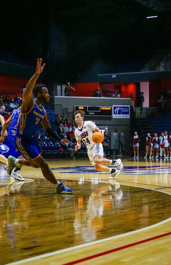 Jack Campion, freshman guard, drives by a defender vs. Midway University Wednesday at the Screaming Eagles Arena.