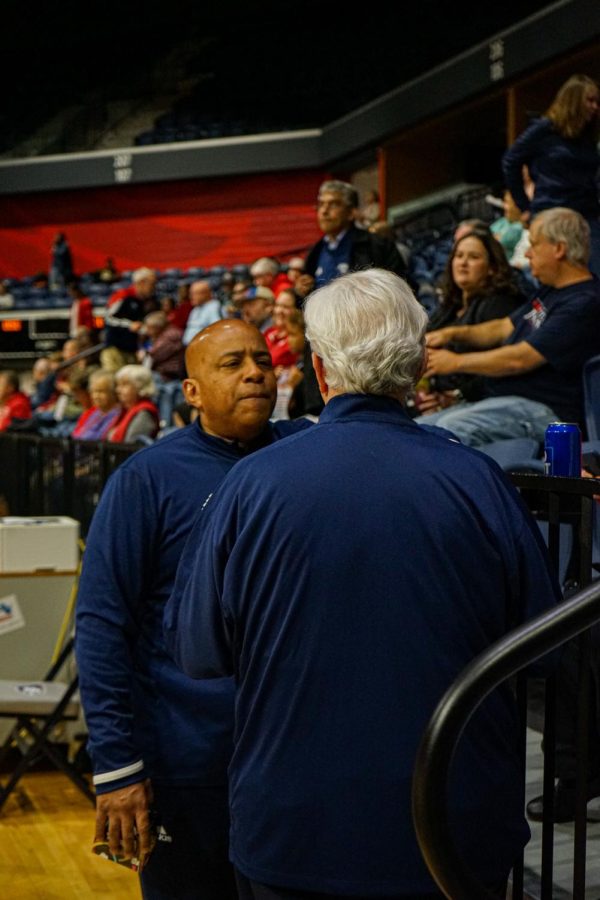 President Ronald Rochon talks to David Bower, Vice President for Development and President of USI Foundation, before the womens basketball game against Western Illinois University Friday in the Screaming Eagles Arena.