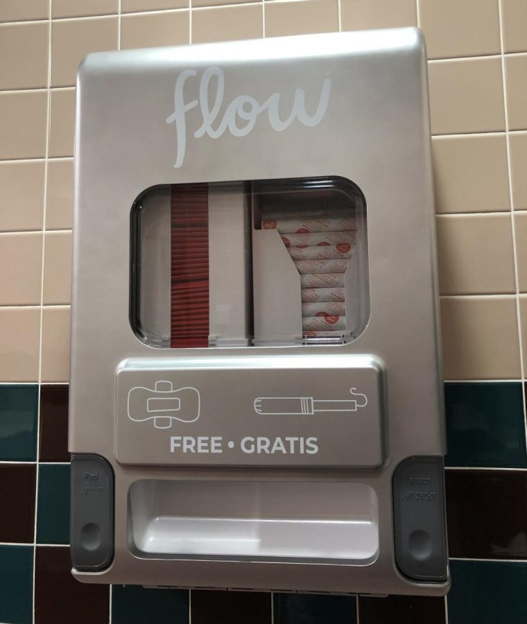 The first free menstrual product dispenser hangs on the wall in the womens bathroom on the first floor of the Health Professions Center. The Student Government Association will be implementing other free menstrual product dispensers on campus. (Photo by Alyssa DeWig)