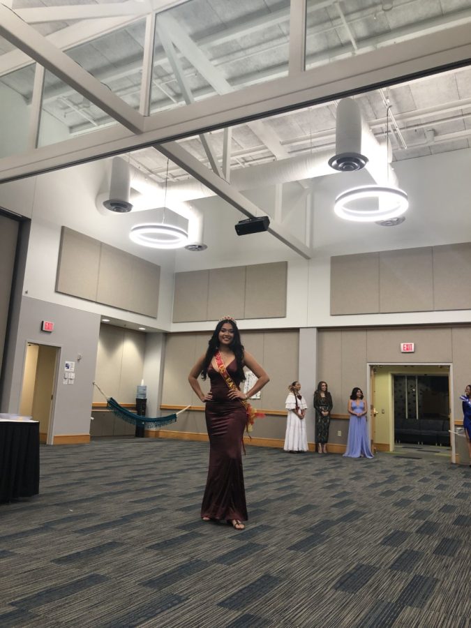 Maria Lopez, sophomore engineering major, smiles as she faces the audience of the PANAS Connection event Thursday in Carter Hall.  Lopez was the 2021-2022 University Center East queen. 