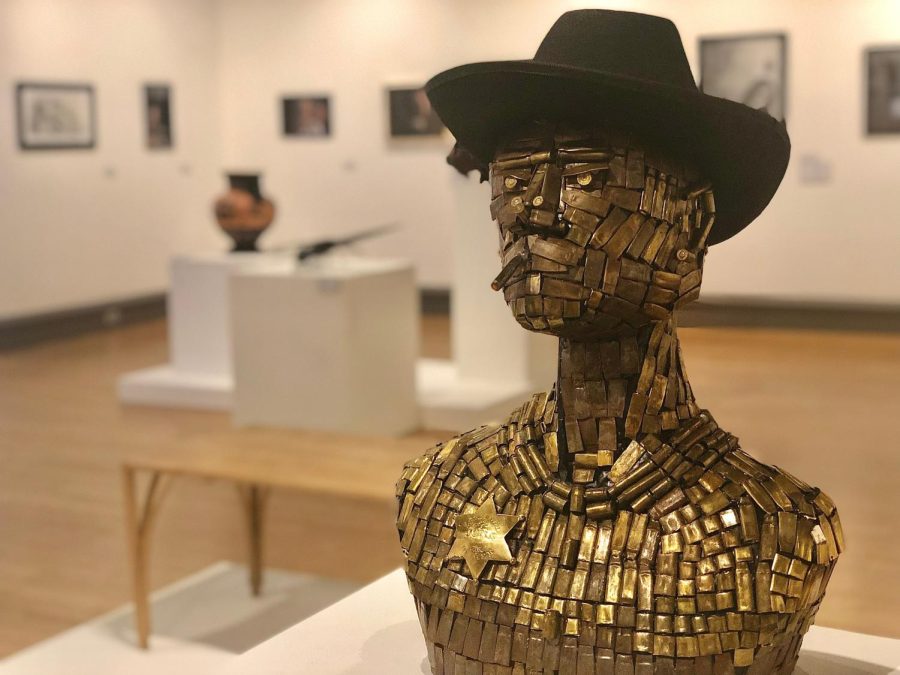 Junk Dealer by Kara Jenson (if you know their grade then add , grade art major) in the 53rd Annual Juried Student Art Exhibition. The art show started Nov. 7 and will end Dec. 9.
