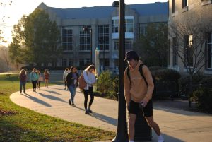 Students walk away from the Liberal Arts Center Wednesday. Departments and staff prepare plans to increase student enrollment after an 11-year decline. (Photo by Ian Young)