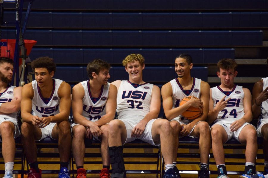 Jacob Polokovich, senior forward, hangs out with the mens basketball team during Media Day Oct. 4 in the Screaming Eagles Arena.