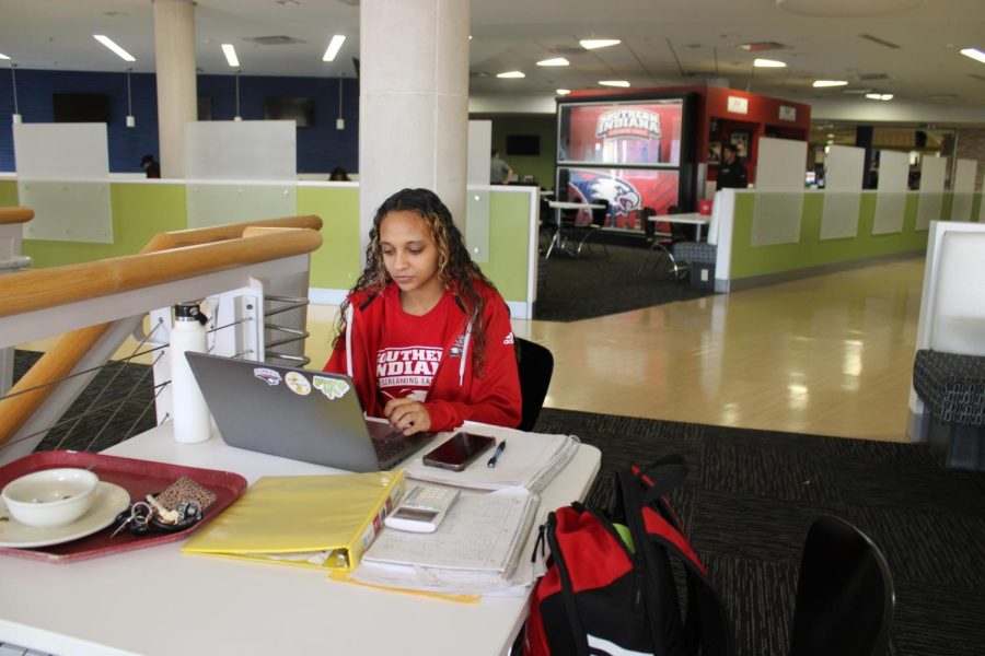 Micah Peals, freshman dental hygiene major, works in University Center West during the power outage Monday. (Photo by Bryce West)