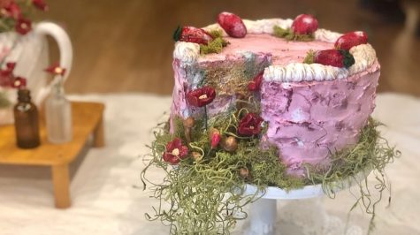 A sculpture of a cake featured in “Lost Picnic,” made by Olivia Supper, is on display in Gallery One of the McCutchan and Pace Galleries. The piece is part of the “From Here She Grows” gallery and will be on display from Jan. 9 through Feb. 5. 