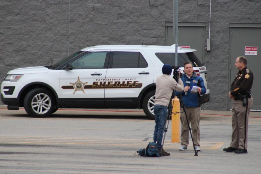 44News reporter interviews Noah Robinson, Vanderburgh County Sheriff, around 4 p.m. Friday outside the closed Evansville West Side Walmart. (Photo by Bryce West)