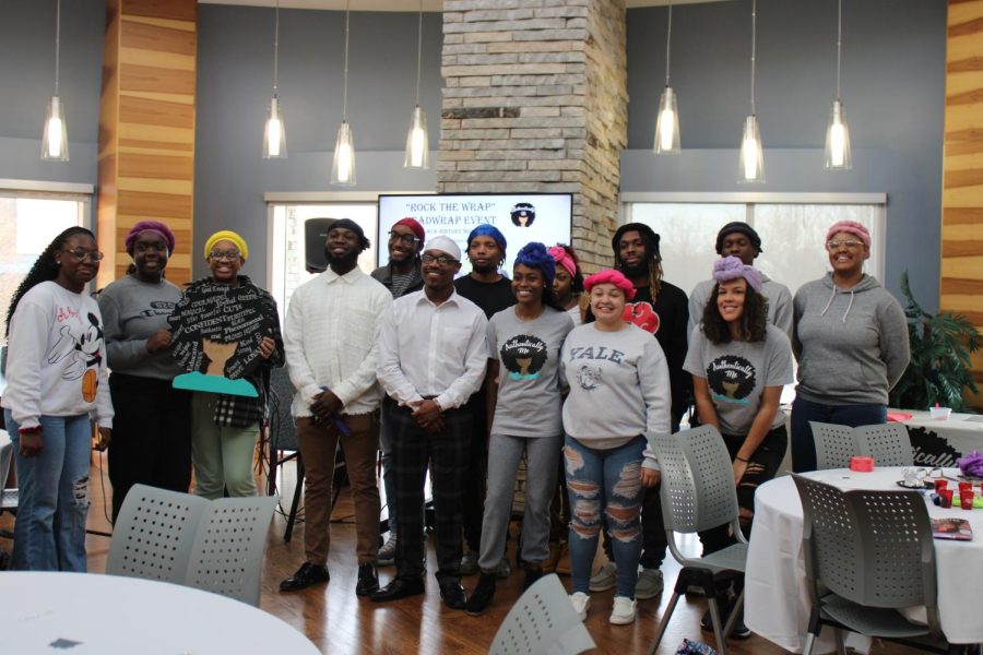 Members of Authentically Me take a group photo Monday in the Traditions Lounge. (Photo by Bryce West)