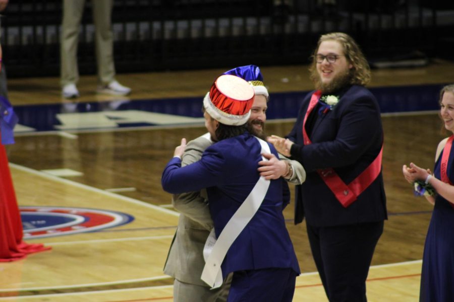 Koby Lindner, senior mechanical engineering major, and Cooper Motz, senior business management major, hug after being crowned the 2023 Homecoming Majesties Saturday in the Screaming Eagles Arena. (Photo by Bryce West)