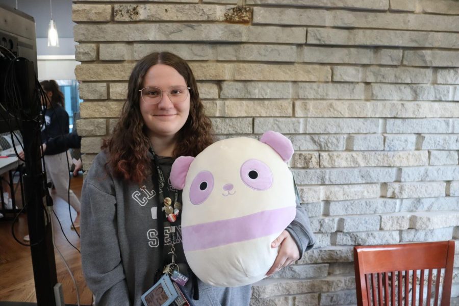 Kyla Power, junior anthropology and liberal studies, smiles with her stuffed animal at the Black History Month Bingo Monday in the Traditions Lounge. Power was the second winner of the game. (Photo by Ian Young)
