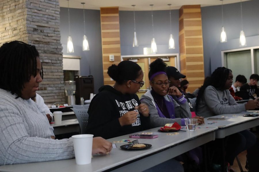 Students wait for the next name to be called at the Black History Month Bingo Monday in the Traditions Lounge. (Photo by Ian Young)