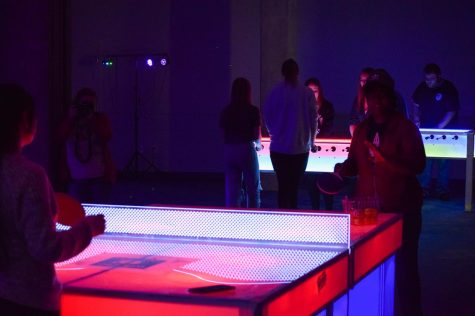 USI students enjoyed the Glowcade room at Springfest 2022. Glowcade included fun lights, ping-pong, foosball, darts, giant jenga and mini-golf. (Photo by Quinton Watt)