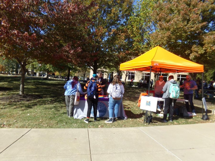 Arbor College Ministry, an inclusive campus ministry, presents their booth to approaching students on The Quad during PrideFest Oct. 21, 2022. 