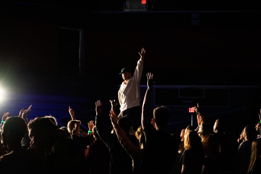 Kid Quill gets the crowd to raise their hands as the hook of the song drops. (Photo by Quinton Watt)